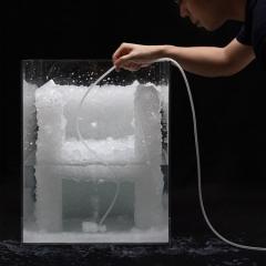 Tokujin Yoshioka demonstrating the process of creating a crystal chair prototype.