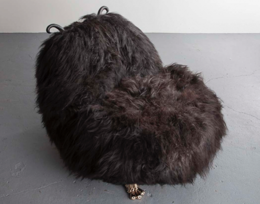 Unique Hairy-Kate Olson lounge chair from the Beast series, in black Icelandic sheep fur, with carved ebony horns and cast bronze coyote feet. Designed and made by The Haas Brothers