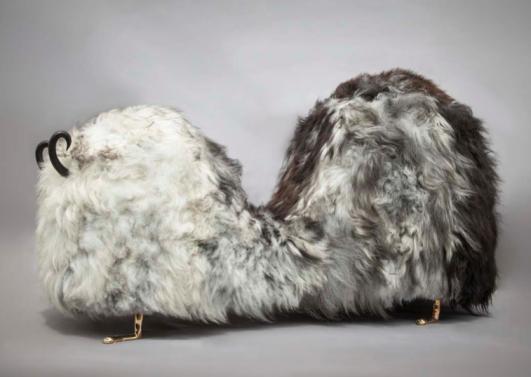 Unique Hairy J. Blige double-hump bench from the Beast series, in Salt N’ Pepper Icelandic sheep fur, with carved ebony horns, cast bronze lion feet, and cast bronze tits and a pussy. Designed and made by The Haas Brothers