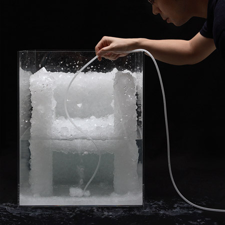 Tokujin Yoshioka demonstrating the process of creating a crystal chair prototype.