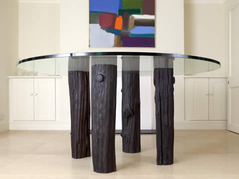 Bog oak and glass circular dining table, 1.55m diameter, oak found in Wereham Fen, Norfolk and air dried for four years