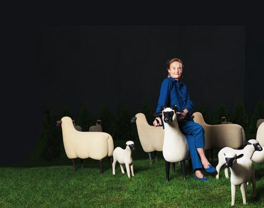 Claude Lalanne photographed in September with a herd of sheep designed by her late husband François-Xavier. photograph by Mathias Braschler & Monika Fischer. © Courtesy the Artists and Paul Kasmin Gallery.