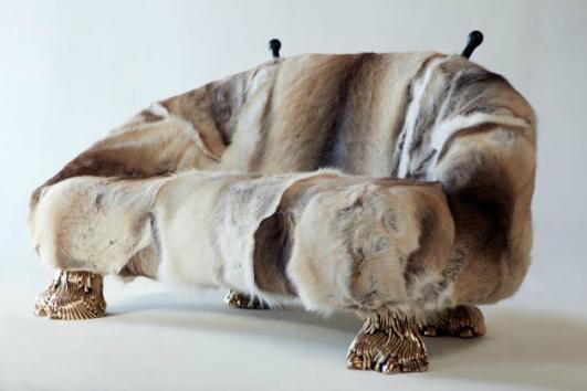 Unique Beast settee with Finnish Reindeer fur, carved wooden horns and cast bronze camel toe feet. Designed and made by The Haas Brothers, Los Angeles, CA, 2013.